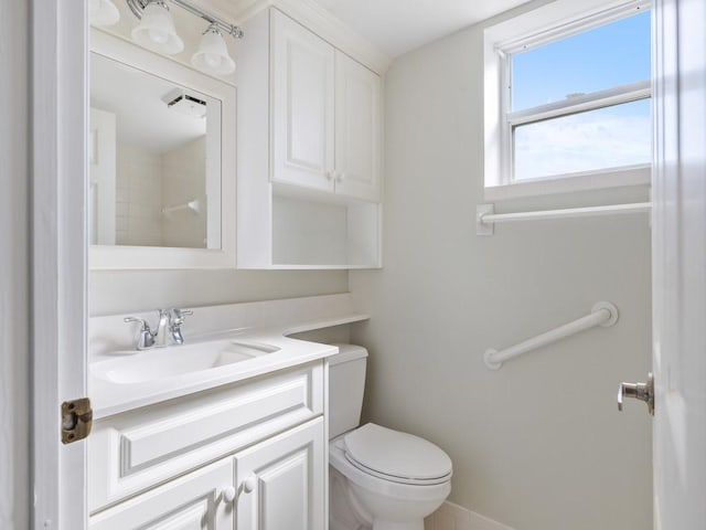 bathroom with vanity and toilet