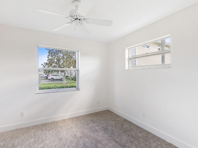 spare room with carpet floors and ceiling fan