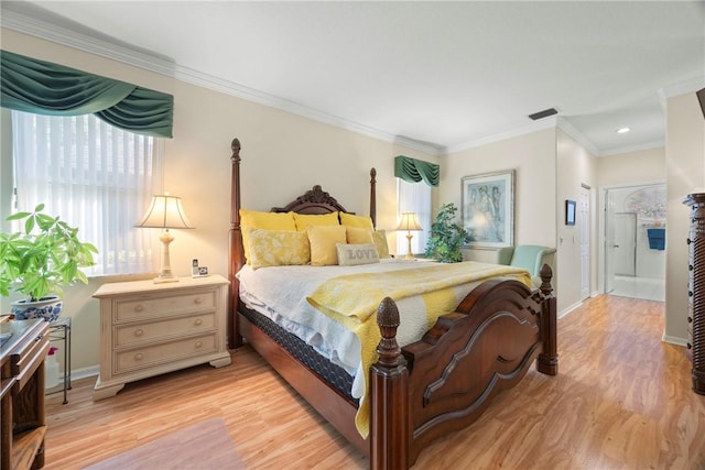 bedroom featuring light wood-type flooring and crown molding