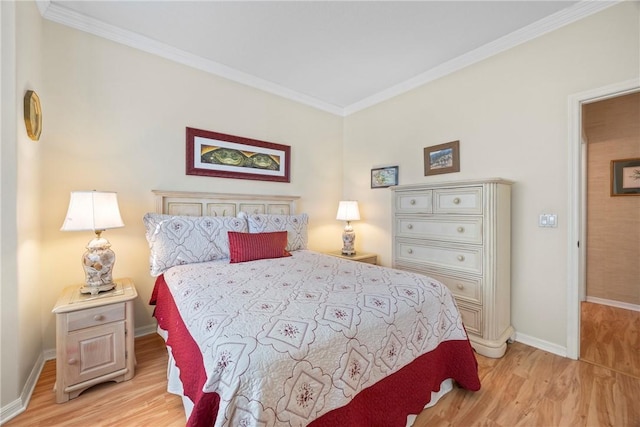 bedroom featuring light hardwood / wood-style floors and ornamental molding