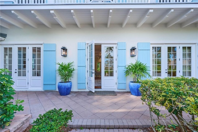 entrance to property with french doors and a patio