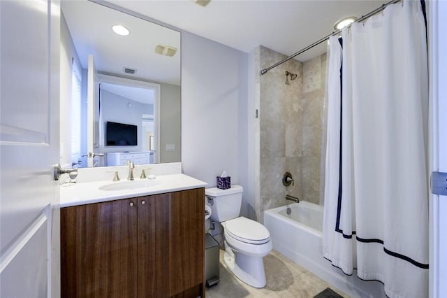 bathroom with shower / bath combo with shower curtain, toilet, vanity, and tile patterned flooring