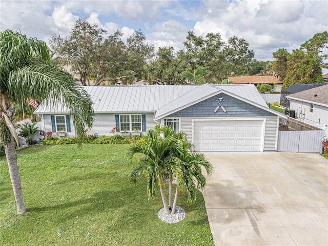 ranch-style house featuring a garage and a front lawn