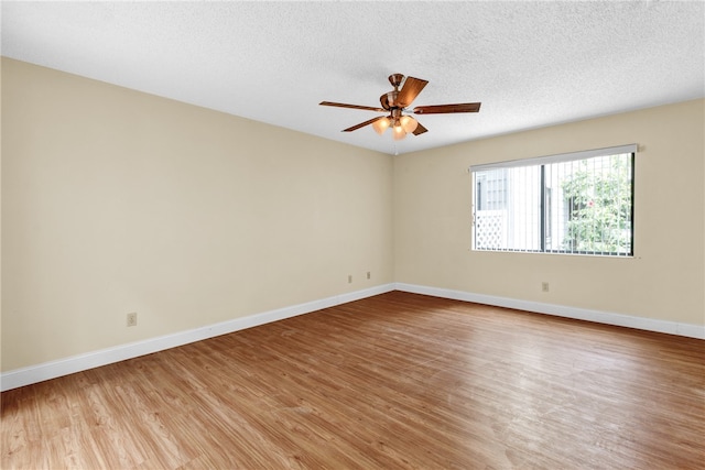 unfurnished room featuring ceiling fan, a textured ceiling, and light hardwood / wood-style floors