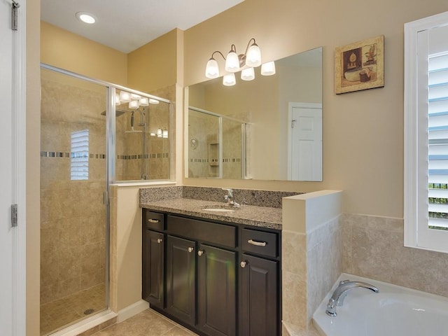 1712 Berkshire Cir SW, Vero Beach, FL 32968 - bathroom featuring a stall shower, vanity, a bath, and tile patterned flooring