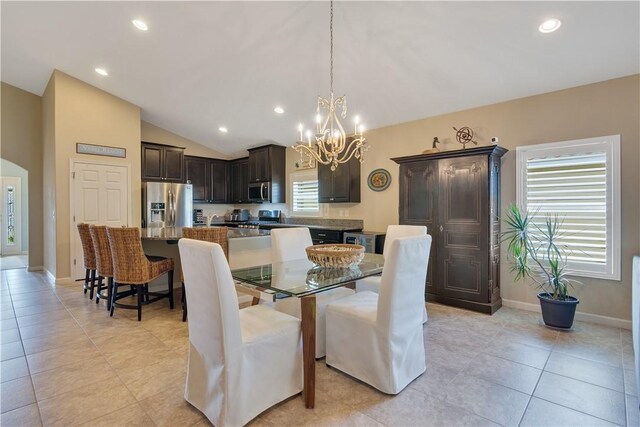 1712 Berkshire Cir SW, Vero Beach, FL 32968 - dining area featuring a chandelier, lofted ceiling, recessed lighting, and light tile patterned floors