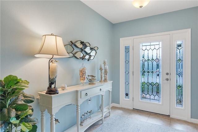 1712 Berkshire Cir SW, Vero Beach, FL 32968 - entrance foyer featuring plenty of natural light and light tile patterned floors