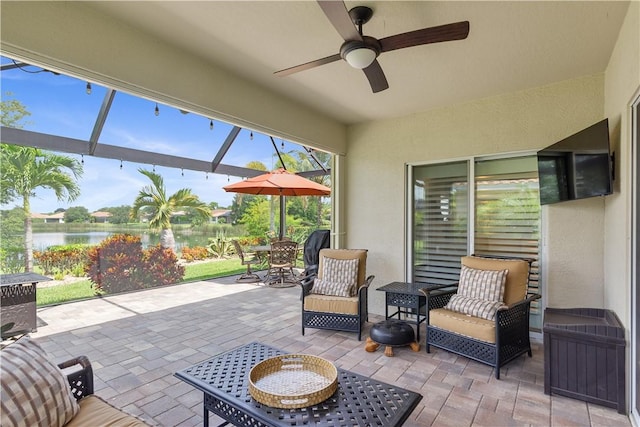 1712 Berkshire Cir SW, Vero Beach, FL 32968 - view of patio / terrace with outdoor dining area, a water view, a ceiling fan, and a lanai