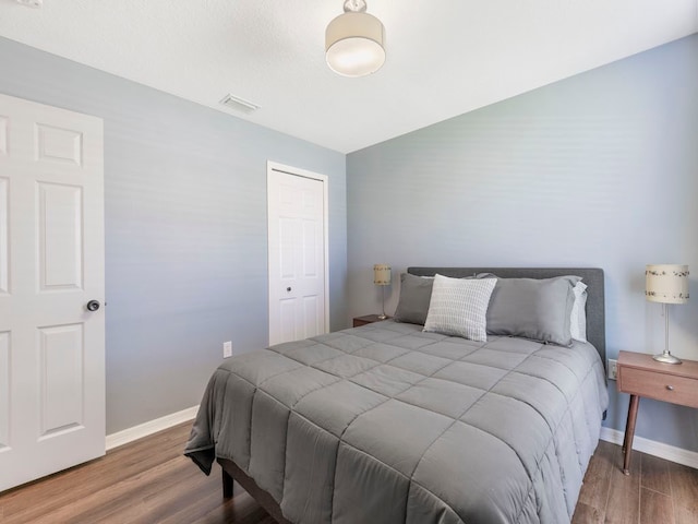 bedroom featuring a closet and hardwood / wood-style floors