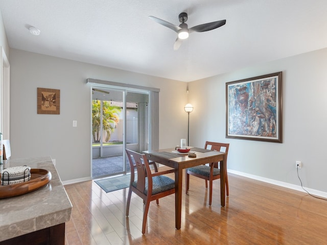 dining area featuring light hardwood / wood-style flooring and ceiling fan