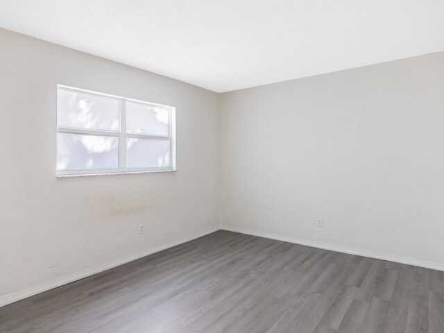 923 22nd Pl Unit 209, Vero Beach, FL 32960 - spare room featuring hardwood / wood-style floors