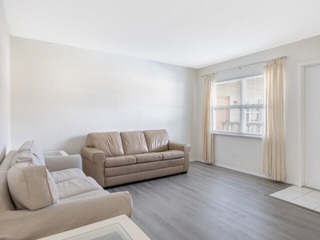 923 22nd Pl Unit 209, Vero Beach, FL 32960 - living room featuring hardwood / wood-style floors