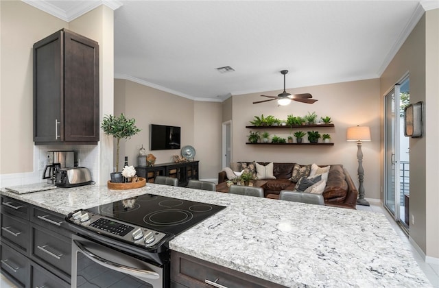 1440 Winding Oaks Cir W Unit A204, Vero Beach, FL 32963 - kitchen with stainless steel range with electric cooktop, a ceiling fan, ornamental molding, dark brown cabinets, and open floor plan