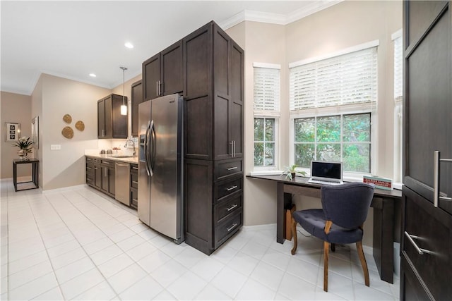 1440 Winding Oaks Cir W Unit A204, Vero Beach, FL 32963 - kitchen featuring appliances with stainless steel finishes, crown molding, a desk, a sink, and dark brown cabinets