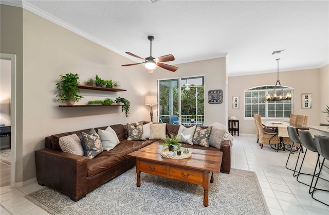 1440 Winding Oaks Cir W Unit A204, Vero Beach, FL 32963 - living room featuring crown molding, light tile patterned floors, a ceiling fan, and a chandelier