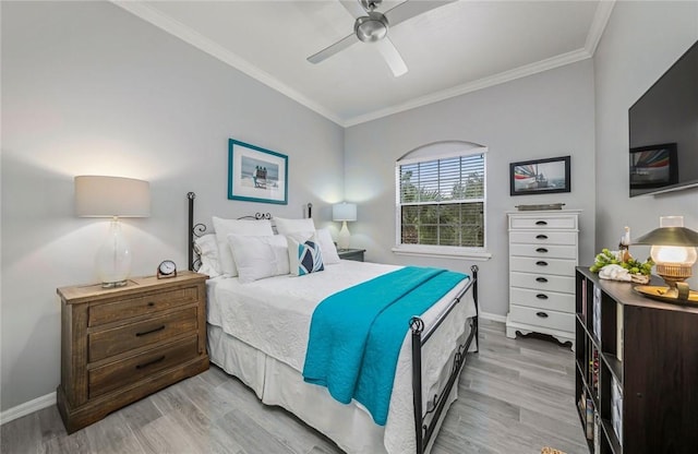 1440 Winding Oaks Cir W Unit A204, Vero Beach, FL 32963 - bedroom featuring ornamental molding, light wood-style flooring, baseboards, and ceiling fan
