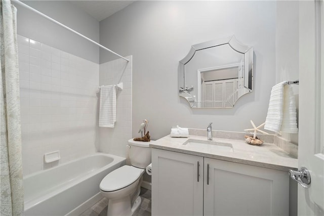 full bath with toilet, shower / tub combo, and vanity