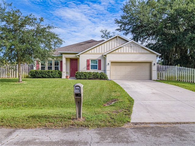 view of front of house with a garage and a front lawn