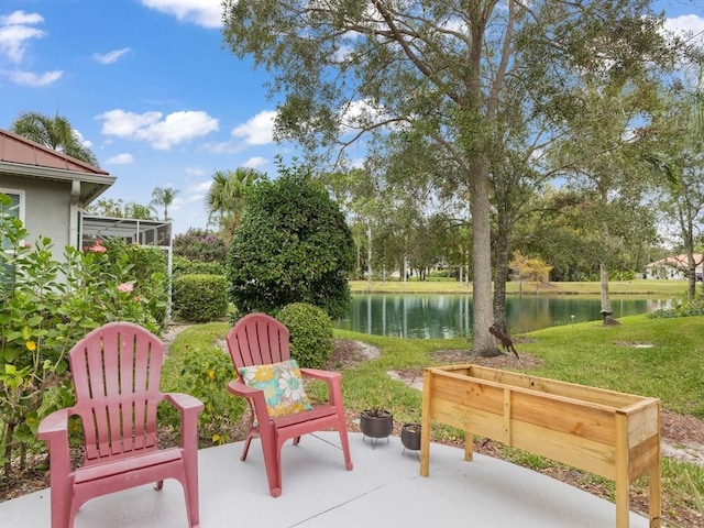 view of patio with a water view