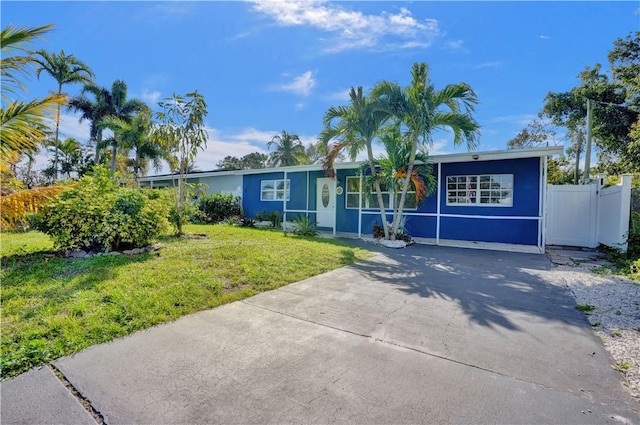 ranch-style home with a front yard