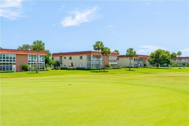 38 Pine Arbor Ln Unit 202, Vero Beach, FL 32962 - surrounding community with view of golf course, a yard, and a putting area
