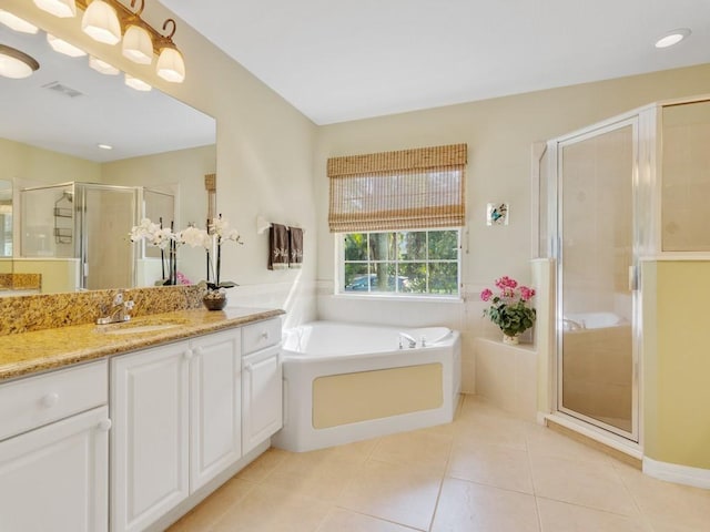 bathroom with vanity, tile patterned floors, and separate shower and tub