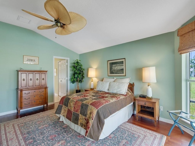 bedroom featuring vaulted ceiling, ceiling fan, and dark hardwood / wood-style flooring