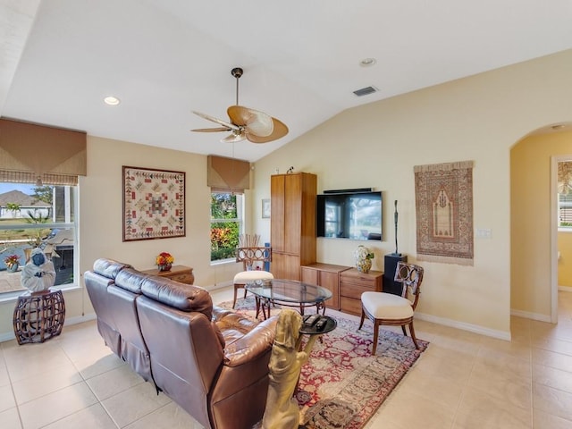 living room featuring light tile patterned flooring, lofted ceiling, and ceiling fan