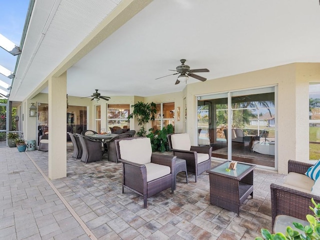 view of patio / terrace featuring ceiling fan and an outdoor living space