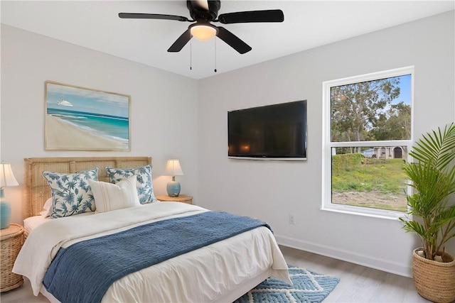 bedroom featuring ceiling fan and light hardwood / wood-style flooring