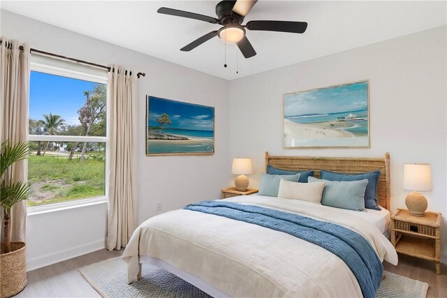 bedroom featuring light hardwood / wood-style flooring and ceiling fan