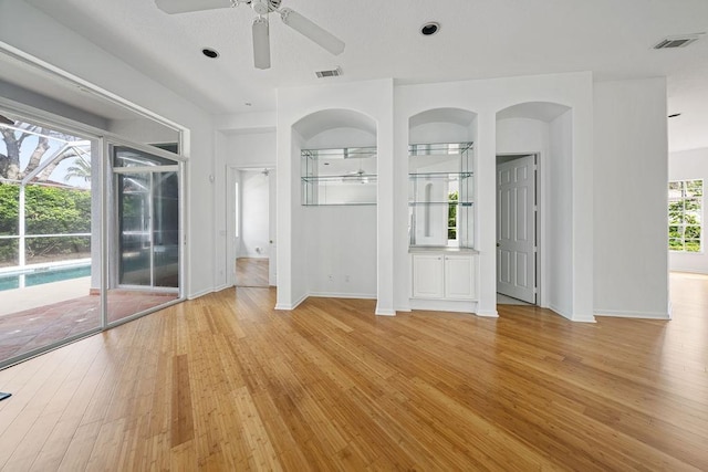 interior space with ceiling fan and light hardwood / wood-style flooring