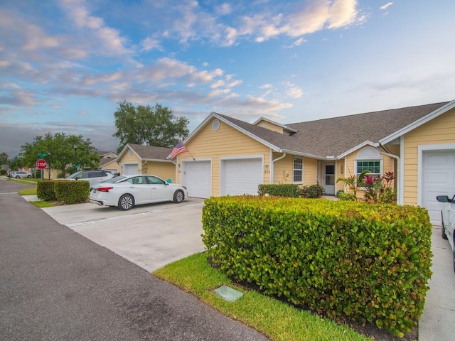 494 6th St, Vero Beach, FL 32962 - ranch-style home featuring driveway, an attached garage, and a shingled roof