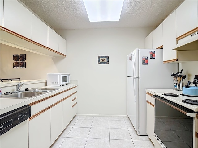 kitchen featuring white cabinets, a textured ceiling, sink, and white appliances