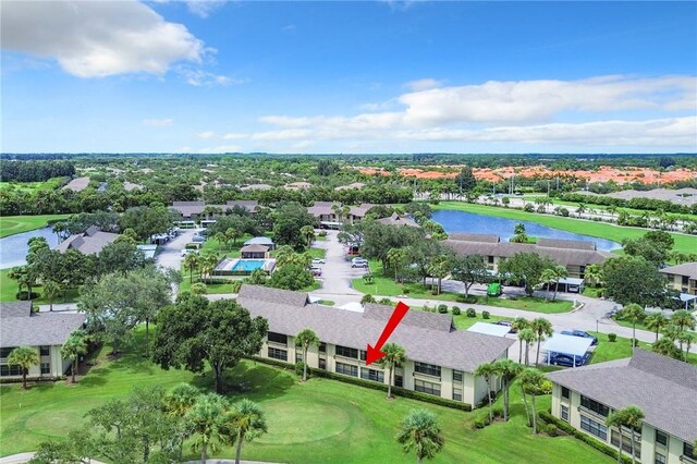 32 Plantation Dr Unit 102, Vero Beach, FL 32966 - aerial perspective of suburban area with a nearby body of water and a golf course
