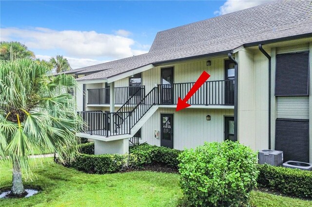32 Plantation Dr Unit 102, Vero Beach, FL 32966 - view of property with central AC and stairway
