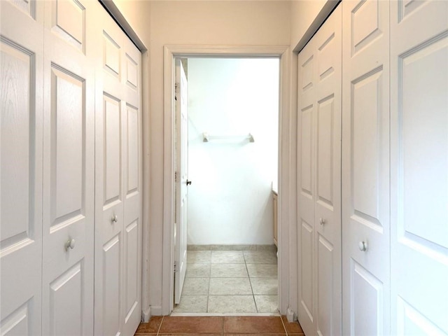 500 7th Pl Unit 102, Vero Beach, FL 32962 - hall with tile patterned flooring and baseboards