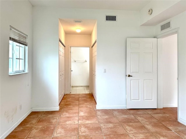 500 7th Pl Unit 102, Vero Beach, FL 32962 - hall featuring baseboards and light tile patterned floors