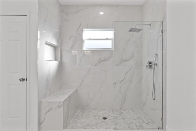 bathroom with tiled shower