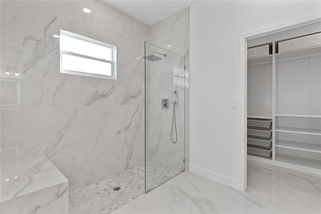 bathroom with tiled shower