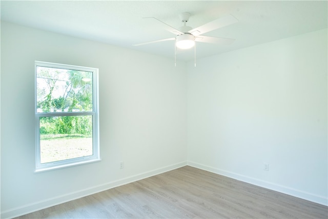 spare room with ceiling fan and light hardwood / wood-style flooring