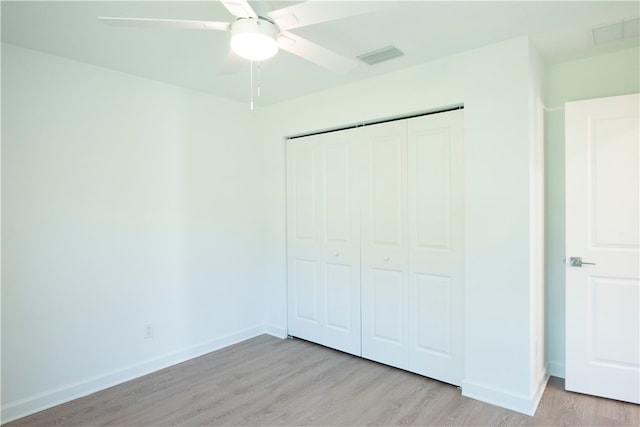 unfurnished bedroom with a closet, ceiling fan, and light hardwood / wood-style flooring