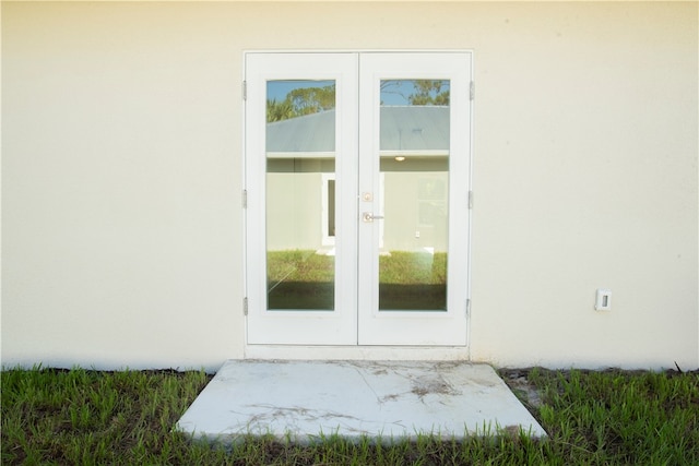 property entrance featuring french doors