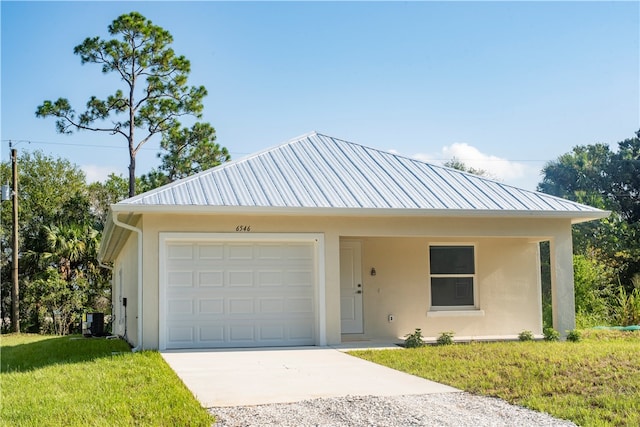 view of front of home featuring a garage and a front yard