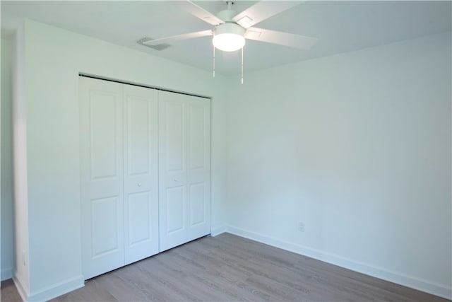 unfurnished bedroom featuring a closet, ceiling fan, and light hardwood / wood-style floors