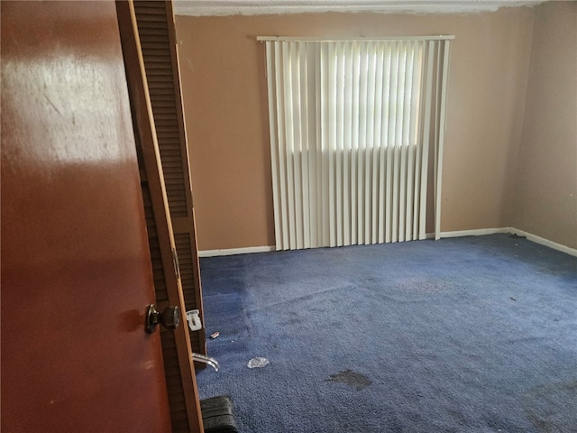 unfurnished room featuring carpet floors