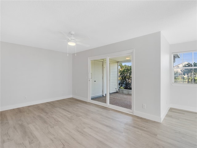 empty room featuring ceiling fan and light hardwood / wood-style flooring