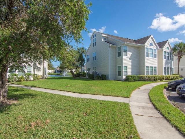 view of property exterior with a lawn