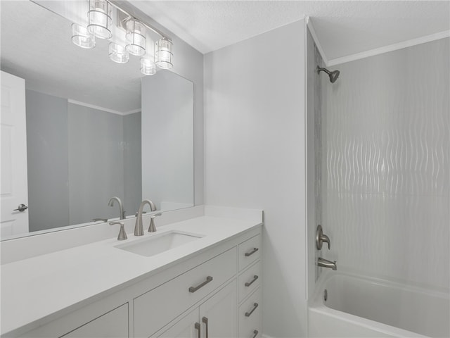 bathroom featuring a textured ceiling, vanity, and shower / washtub combination