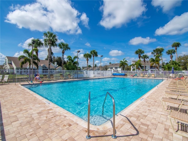 view of swimming pool with a patio